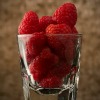 raspberries in glass cup