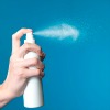 spraying hairspray