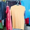 airing dry shirts on plastic hangers