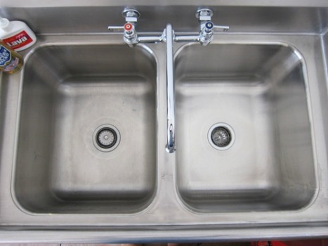 before and after of stainless steel sink cleaned with Bar Keepers Friend