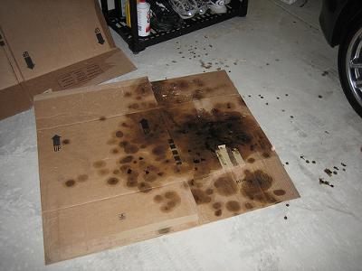 Catch Oil From Dripping On Your Garage Floor With Cardboard