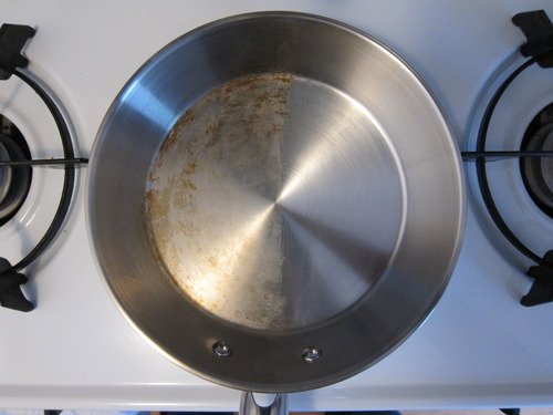 before and after of pan cleaned with Bar Keepers Friend cookware cleanser